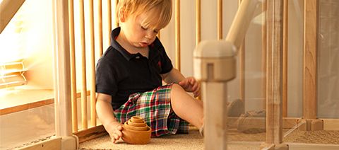 child playing with stacking toys