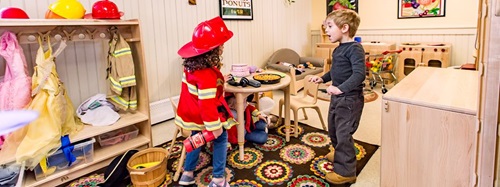 children playing in a classroom