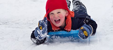 boy sledding