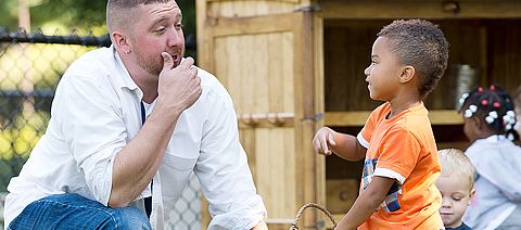 teacher talking to a child