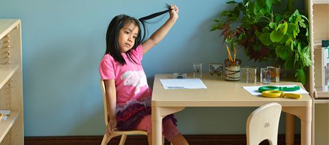 child sitting at a table