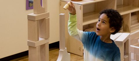 boy stacking blocks