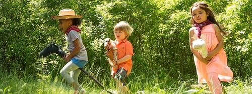 three children playing outside