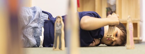 child lying on the floor