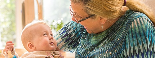 teacher holding a child