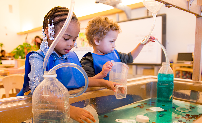 Kids playing with sand and water table