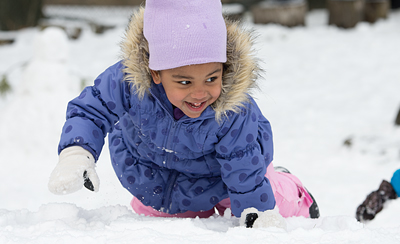 child playing in snow