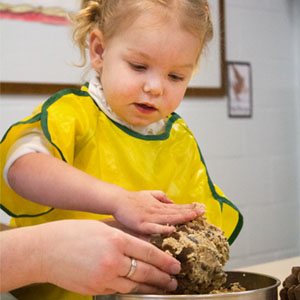 girl with a pinecone