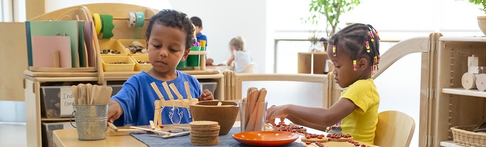 Two children doing crafts at a table